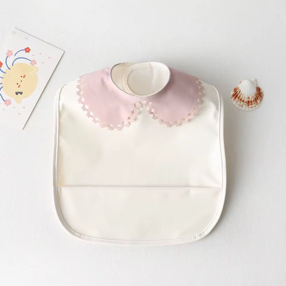 Mini babero impermeable cuello blonda