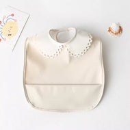 Mini babero impermeable cuello blonda