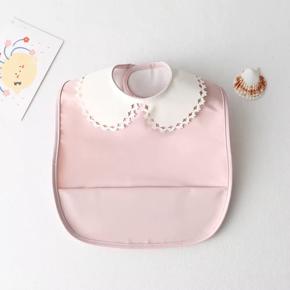 Mini babero impermeable cuello blonda