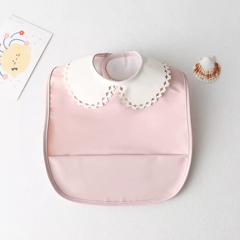 Mini babero impermeable cuello blonda