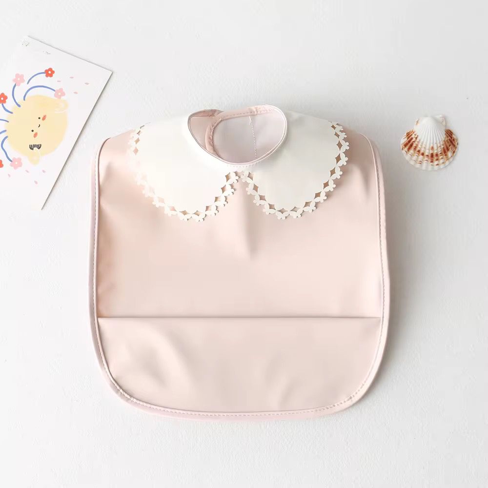 Mini babero impermeable cuello blonda