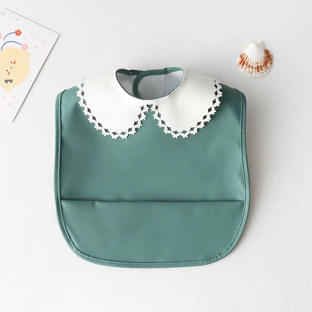 Mini babero impermeable cuello blonda