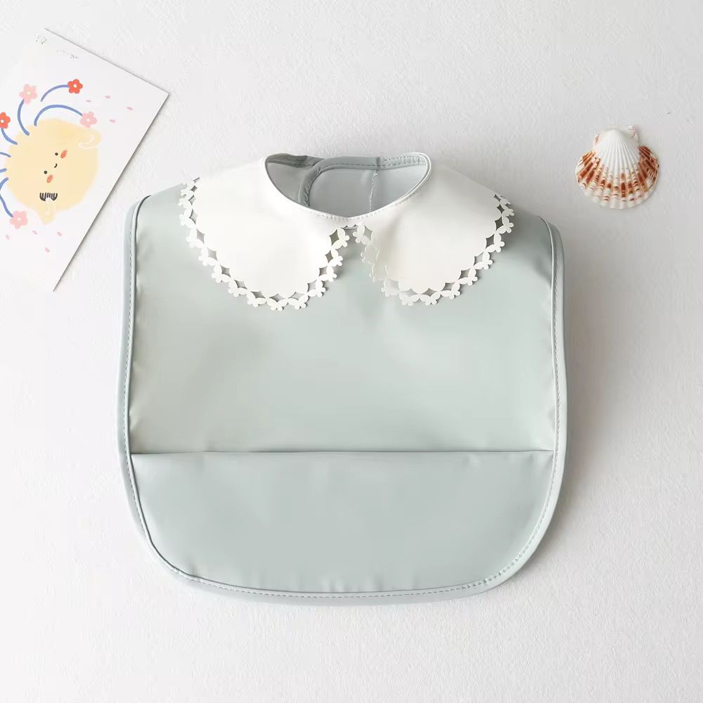 Mini babero impermeable cuello blonda